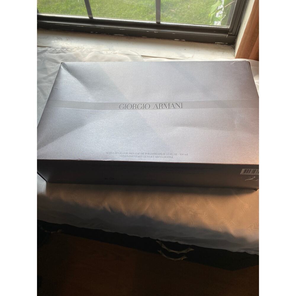Empty George Armani boots box 10/16.5/4 has some flowers on one end